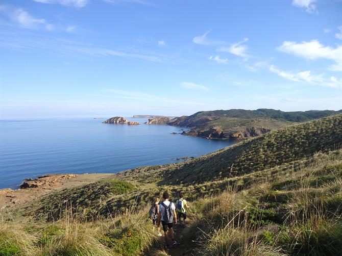 Hikers along the Cami de Cavalls, the north