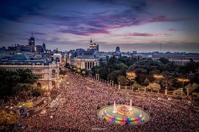 People celebrating gay pride in Madrid around the Cibeles fountain