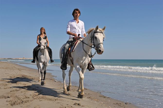 Ridetur på stranden