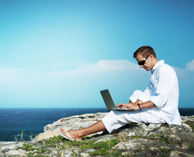Young Man with Laptop Outdoor