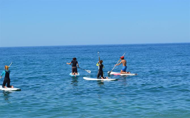 Paddle surfing