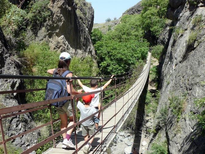 Crossing the hanging bridges of Monachil, Granada