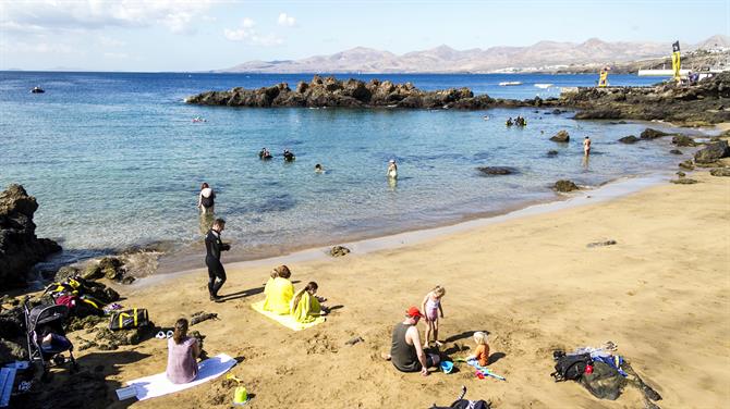 Families on the beach at Playa Chica in Lanzarote