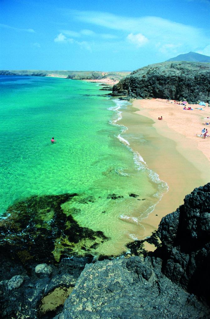 Emerald green waters at Playa de la Cera in Lanzarote